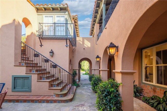 7 Ocean Heights Dr, Newport Coast, CA 92657 - doorway to property featuring stucco siding and a tiled roof