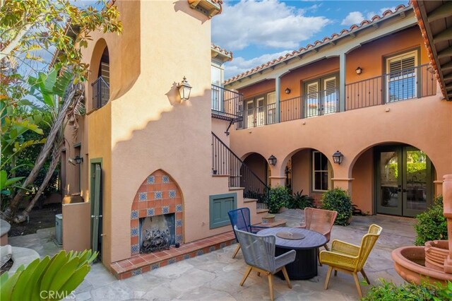 7 Ocean Heights Dr, Newport Coast, CA 92657 - view of patio / terrace with french doors and a balcony