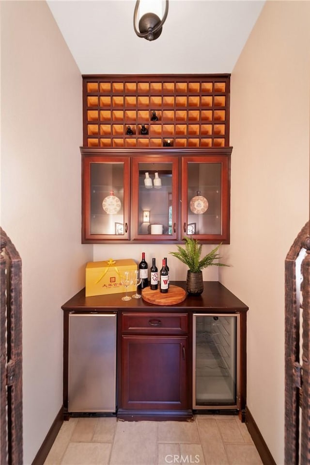 7 Ocean Heights Dr, Newport Coast, CA 92657 - indoor dry bar with wine cooler, fridge, baseboards, and light tile patterned floors