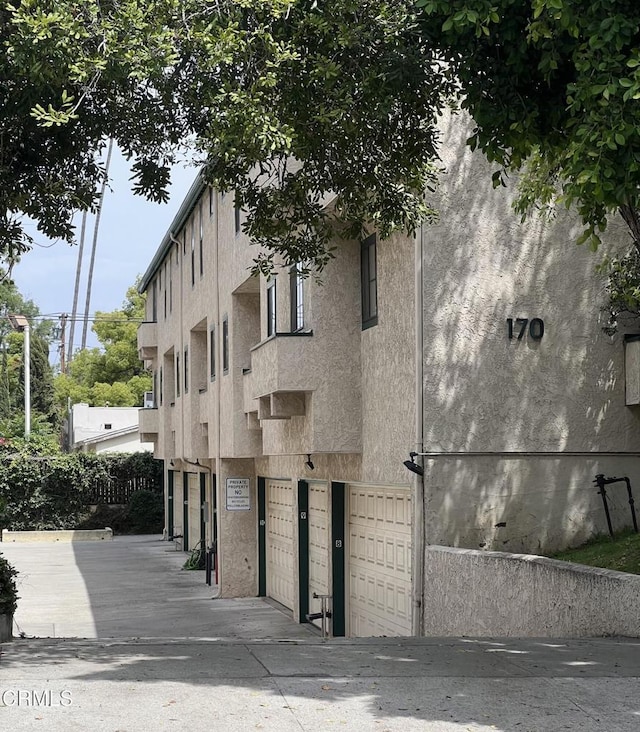 170170 N Sierra Bonita Ave Unit 11, Pasadena, CA 91106 - view of building exterior with an attached garage