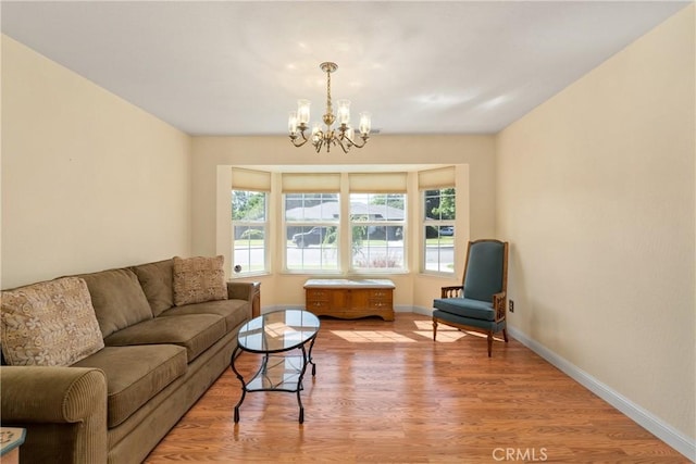 156 Greenfield Dr, Chico, CA 95973 - living area featuring plenty of natural light, a chandelier, light wood-type flooring, and baseboards