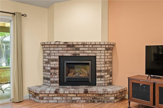 156 Greenfield Dr, Chico, CA 95973 - detailed view of wood finished floors and a brick fireplace