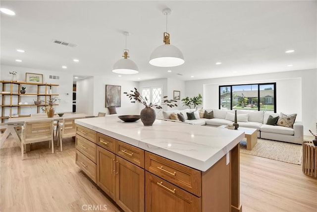 4732 Tucana St, Yorba Linda, CA 92886 - kitchen with light wood-style floors, a kitchen island, pendant lighting, recessed lighting, and open floor plan