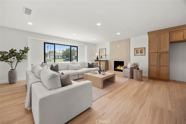 4732 Tucana St, Yorba Linda, CA 92886 - living area featuring light wood-style floors, recessed lighting, a large fireplace, and baseboards