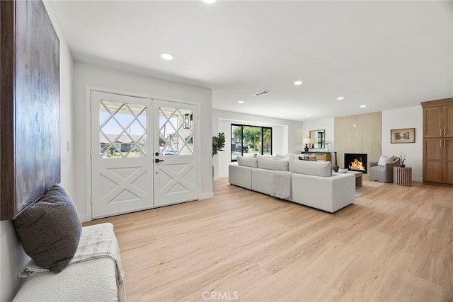 4732 Tucana St, Yorba Linda, CA 92886 - living room featuring light wood-style floors, recessed lighting, a fireplace, french doors, and baseboards