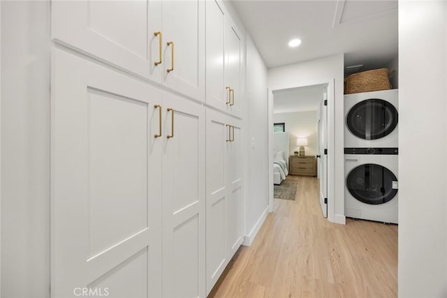 4732 Tucana St, Yorba Linda, CA 92886 - laundry area featuring stacked washing machine and dryer, light wood finished floors, recessed lighting, and baseboards