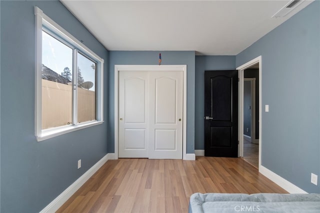 2505 Stuart Ave, Clovis, CA 93611 - unfurnished bedroom with wood finished floors, baseboards, and a closet