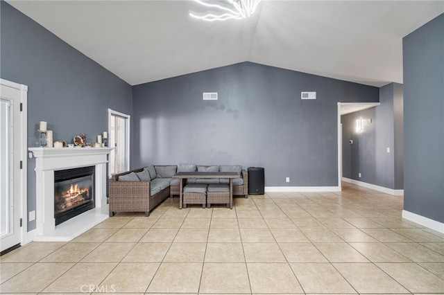 2505 Stuart Ave, Clovis, CA 93611 - living room with light tile patterned flooring, a glass covered fireplace, baseboards, and high vaulted ceiling
