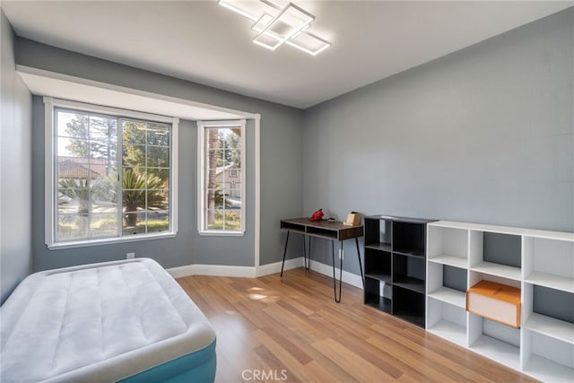 2505 Stuart Ave, Clovis, CA 93611 - bedroom with light wood-style flooring and baseboards