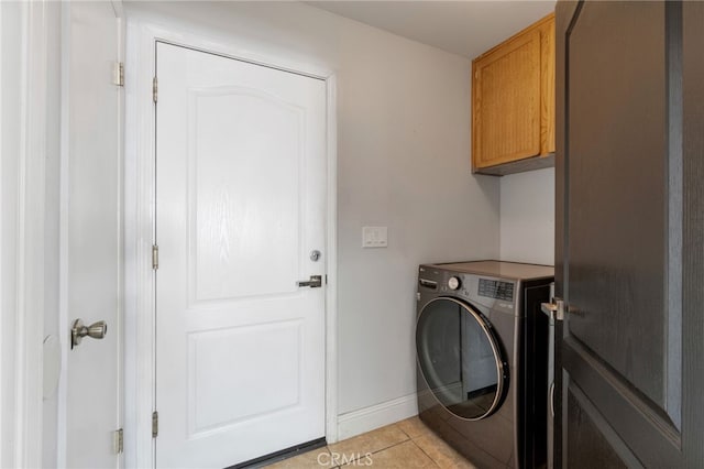 2505 Stuart Ave, Clovis, CA 93611 - laundry area featuring washer / clothes dryer, cabinet space, light tile patterned floors, and baseboards