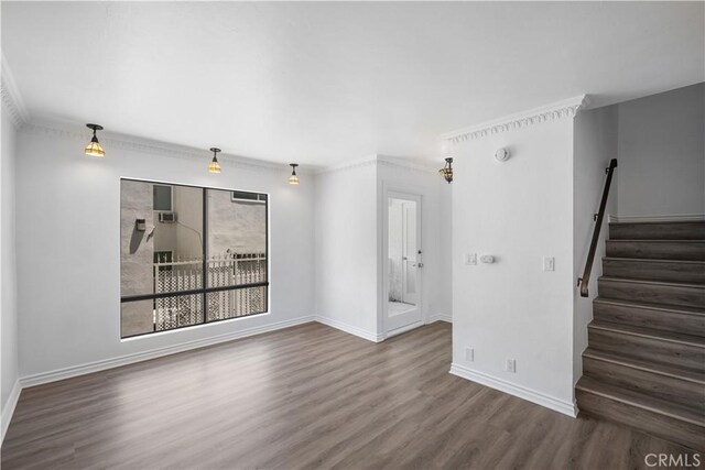 11954 Mayfield Ave Unit 3, Los Angeles, CA 90049 - unfurnished living room with wood finished floors, stairs, baseboards, and ornamental molding