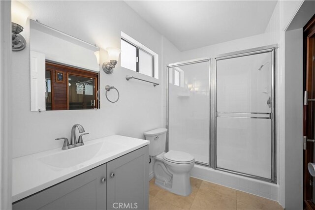 11954 Mayfield Ave Unit 3, Los Angeles, CA 90049 - bathroom featuring a shower stall, vanity, toilet, and tile patterned floors