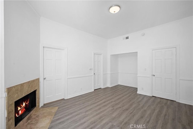 11954 Mayfield Ave Unit 3, Los Angeles, CA 90049 - unfurnished living room with wood finished floors, a premium fireplace, crown molding, and baseboards