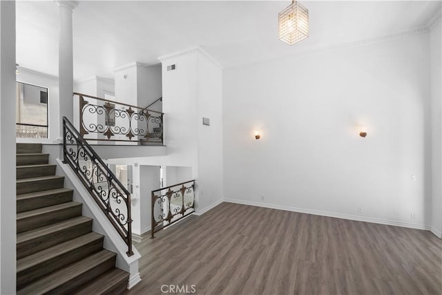 11954 Mayfield Ave Unit 3, Los Angeles, CA 90049 - staircase with wood finished floors, baseboards, and decorative columns