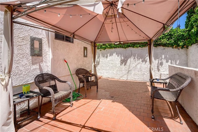 11954 Mayfield Ave Unit 3, Los Angeles, CA 90049 - view of patio with a gazebo and fence