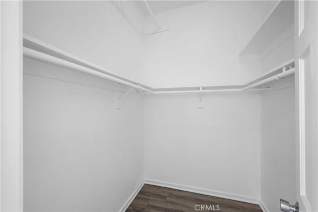 11954 Mayfield Ave Unit 3, Los Angeles, CA 90049 - spacious closet featuring dark wood-style flooring