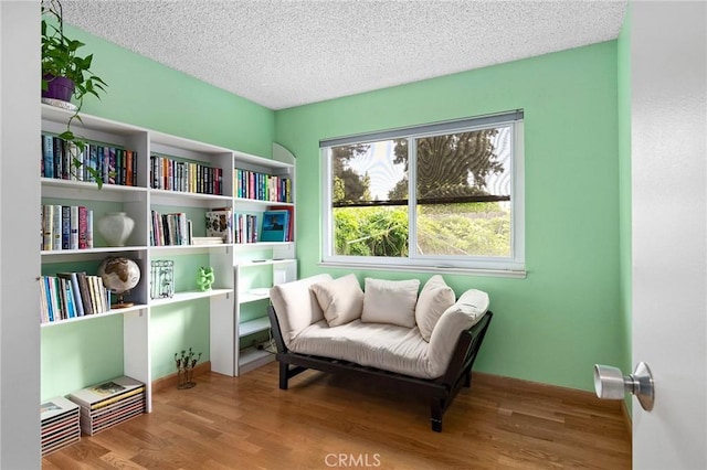 788 Marcia Ct, Chico, CA 95973 - sitting room with wood finished floors and a textured ceiling
