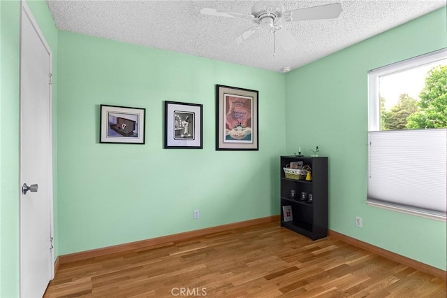 788 Marcia Ct, Chico, CA 95973 - unfurnished room featuring light wood finished floors, a textured ceiling, ceiling fan, and baseboards