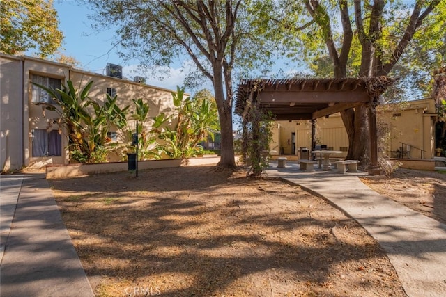 view of home's community with a patio area and a pergola