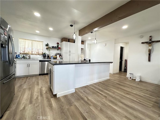 309 Santo Dr, San Jacinto, CA 92583 - kitchen with stainless steel appliances, open shelves, light wood-type flooring, recessed lighting, and dark countertops