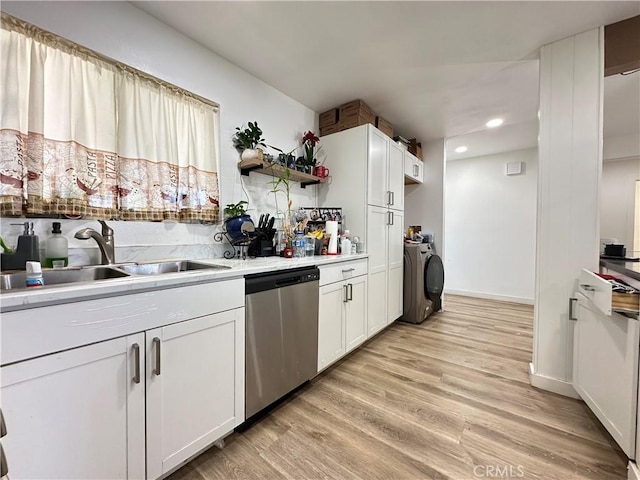 309 Santo Dr, San Jacinto, CA 92583 - kitchen featuring dishwasher, a sink, washer and clothes dryer, open shelves, and light wood finished floors