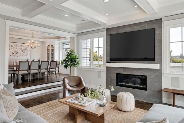 2711 Elm Ave, Manhattan Beach, CA 90266 - living area with wood finished floors, beamed ceiling, plenty of natural light, a tiled fireplace, and recessed lighting