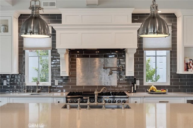2711 Elm Ave, Manhattan Beach, CA 90266 - kitchen with a sink, backsplash, and plenty of natural light