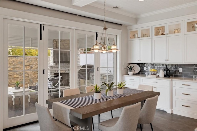 2711 Elm Ave, Manhattan Beach, CA 90266 - dining space with ornamental molding and a chandelier