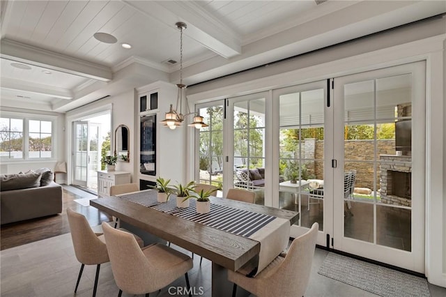 2711 Elm Ave, Manhattan Beach, CA 90266 - dining space with beamed ceiling, wood finished floors, crown molding, and recessed lighting