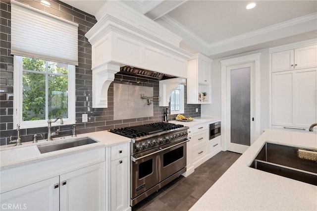 2711 Elm Ave, Manhattan Beach, CA 90266 - kitchen with range with two ovens, built in microwave, a sink, white cabinetry, and crown molding