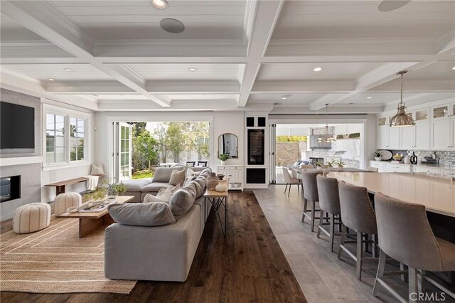 2711 Elm Ave, Manhattan Beach, CA 90266 - living room with coffered ceiling, dark wood-style floors, beamed ceiling, recessed lighting, and ornamental molding