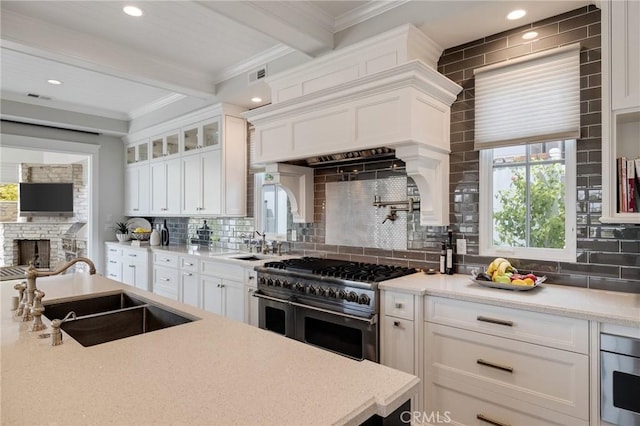 2711 Elm Ave, Manhattan Beach, CA 90266 - kitchen with a sink, appliances with stainless steel finishes, ornamental molding, beam ceiling, and tasteful backsplash