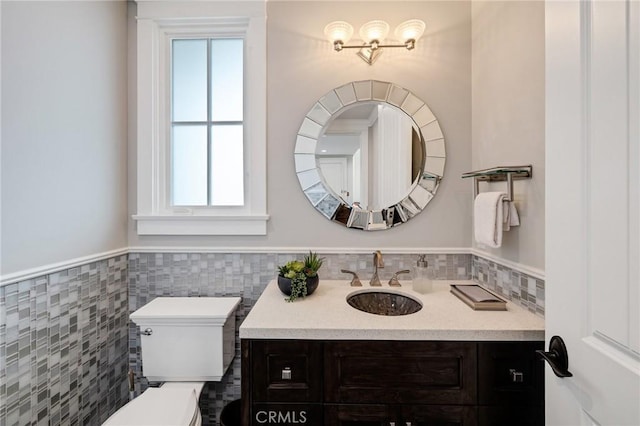 2711 Elm Ave, Manhattan Beach, CA 90266 - bathroom with wainscoting, toilet, tile walls, and vanity