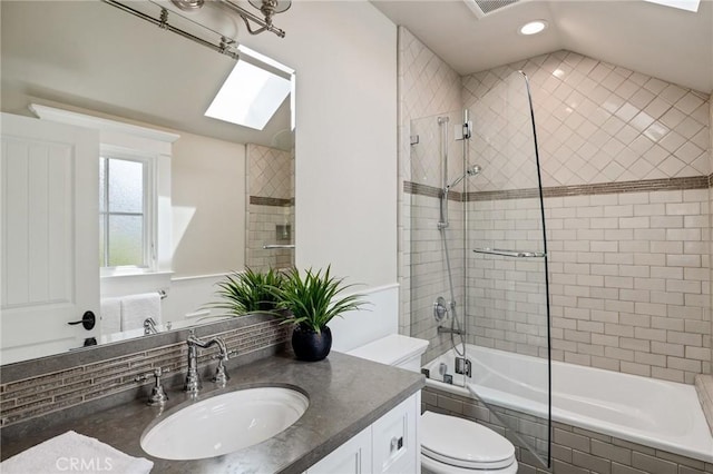 2711 Elm Ave, Manhattan Beach, CA 90266 - bathroom featuring a skylight, recessed lighting, toilet, tiled shower / bath, and vanity