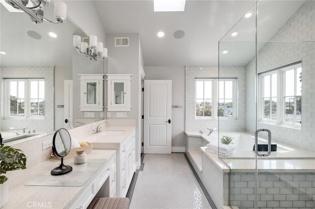 2711 Elm Ave, Manhattan Beach, CA 90266 - bathroom with healthy amount of natural light, a bath, vanity, tile patterned flooring, and recessed lighting