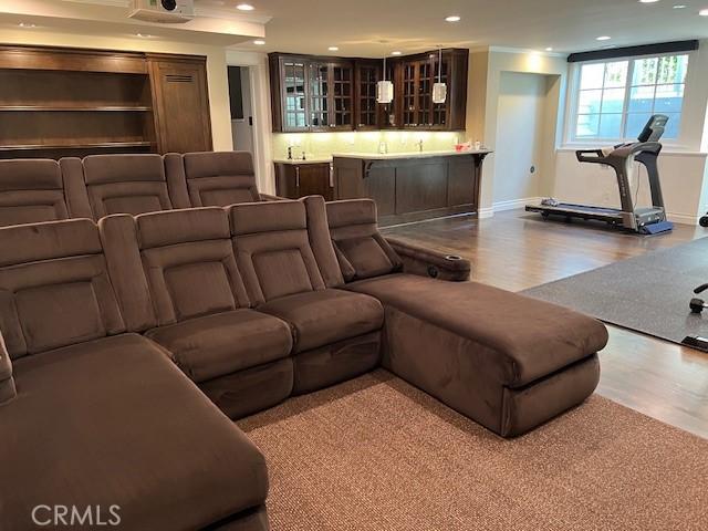2711 Elm Ave, Manhattan Beach, CA 90266 - home theater featuring wood finished floors, recessed lighting, bar, and baseboards