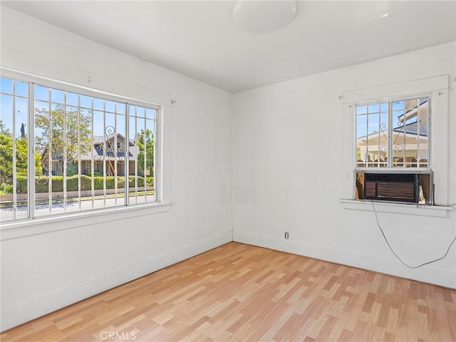 911 N Dos Robles Pl, Alhambra, CA 91801 - spare room with wood finished floors, cooling unit, and baseboards