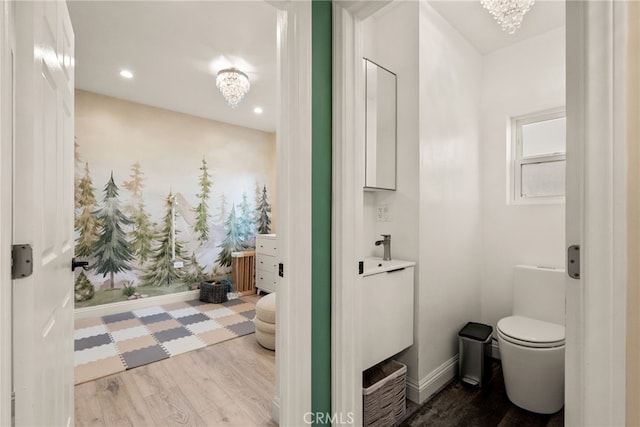 2217 S Gaffey St, San Pedro, CA 90731 - bathroom featuring a chandelier, wood finished floors, vanity, and recessed lighting