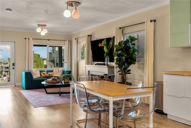 2217 S Gaffey St, San Pedro, CA 90731 - dining space featuring light wood finished floors and crown molding