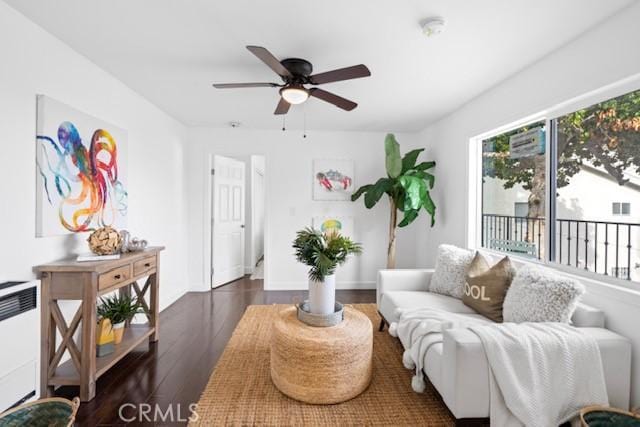 2217 S Gaffey St, San Pedro, CA 90731 - living room featuring a ceiling fan, wood finished floors, and radiator