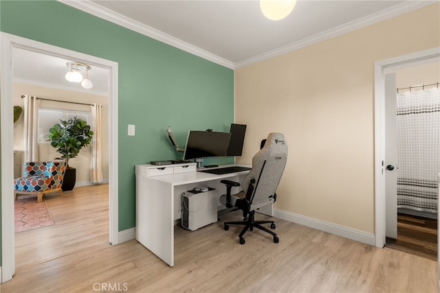 office space featuring crown molding, wood finished floors, and baseboards