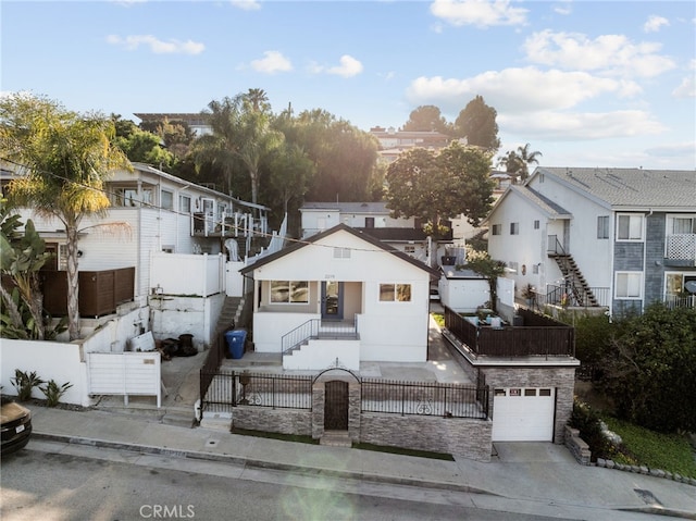 2217 S Gaffey St, San Pedro, CA 90731 - view of front facade with a fenced front yard, a residential view, stairs, and driveway