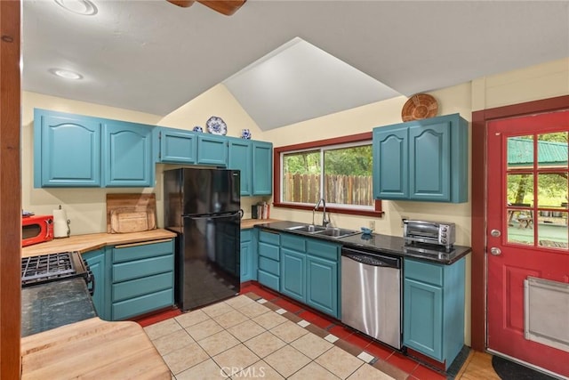 5338 Deception River Rd, Chico, CA 95928 - kitchen featuring stainless steel dishwasher, freestanding refrigerator, a sink, blue cabinetry, and healthy amount of natural light