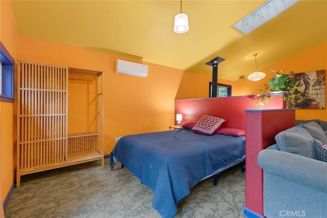 5338 Deception River Rd, Chico, CA 95928 - bedroom featuring carpet flooring, a wall unit AC, vaulted ceiling, and a skylight