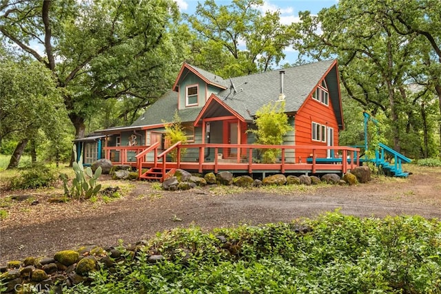 5338 Deception River Rd, Chico, CA 95928 - view of front facade featuring a shingled roof and a wooden deck