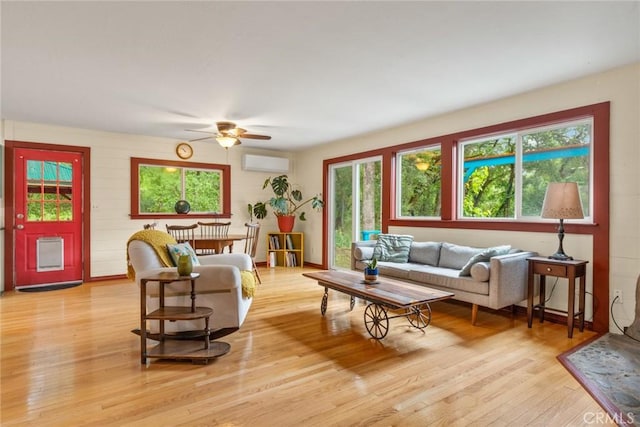 5338 Deception River Rd, Chico, CA 95928 - living room with a wall unit AC, ceiling fan, light wood finished floors, and plenty of natural light