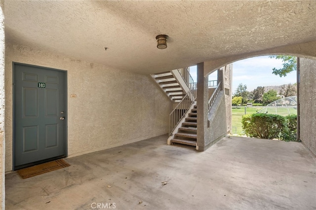 2045 Las Colinas Cir Unit 103, Corona, CA 92879 - doorway to property featuring stucco siding, a patio area, and fence