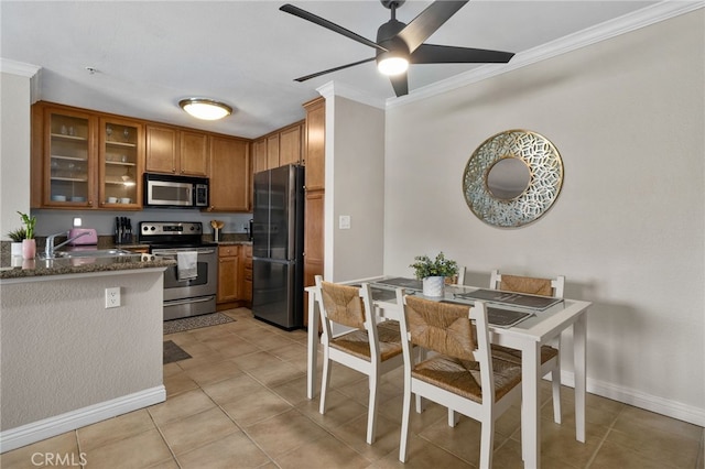 2045 Las Colinas Cir Unit 103, Corona, CA 92879 - kitchen featuring appliances with stainless steel finishes, ornamental molding, a sink, brown cabinets, and a ceiling fan