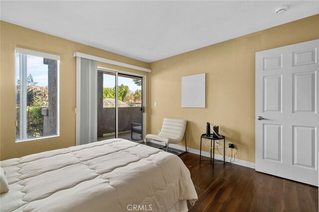 2045 Las Colinas Cir Unit 103, Corona, CA 92879 - bedroom featuring access to outside, wood finished floors, and baseboards