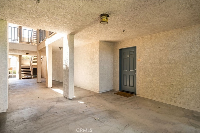 2045 Las Colinas Cir Unit 103, Corona, CA 92879 - view of exterior entry with stucco siding and a patio